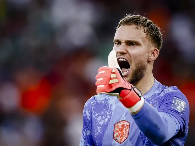 Morocco players celebrate after defeating the Netherlands 3-2 on penalties as goalkeeper Yassine Bounou celebrates his match-winning performance during the FIFA World Cup.