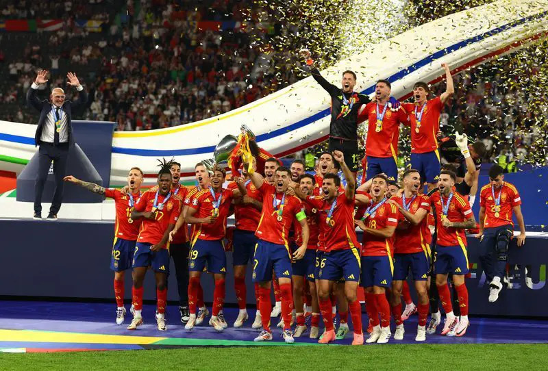 Spain players celebrate after Mikel Merino scores the winning goal in Spain's 2-1 World Cup quarter-final victory over Belgium.