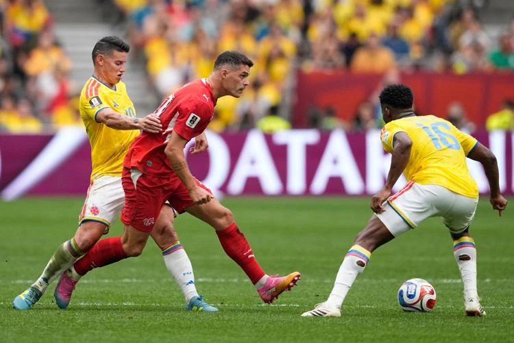 Gregor Kobel celebrates after Switzerland defeated Colombia on penalties to reach the FIFA World Cup quarter-finals.