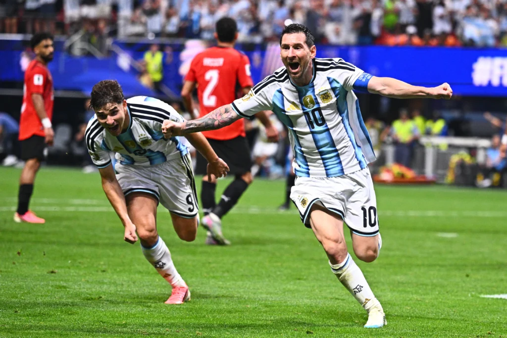 Argentina players celebrate a 3-1 extra-time victory over Switzerland to reach the FIFA World Cup semi-final.
