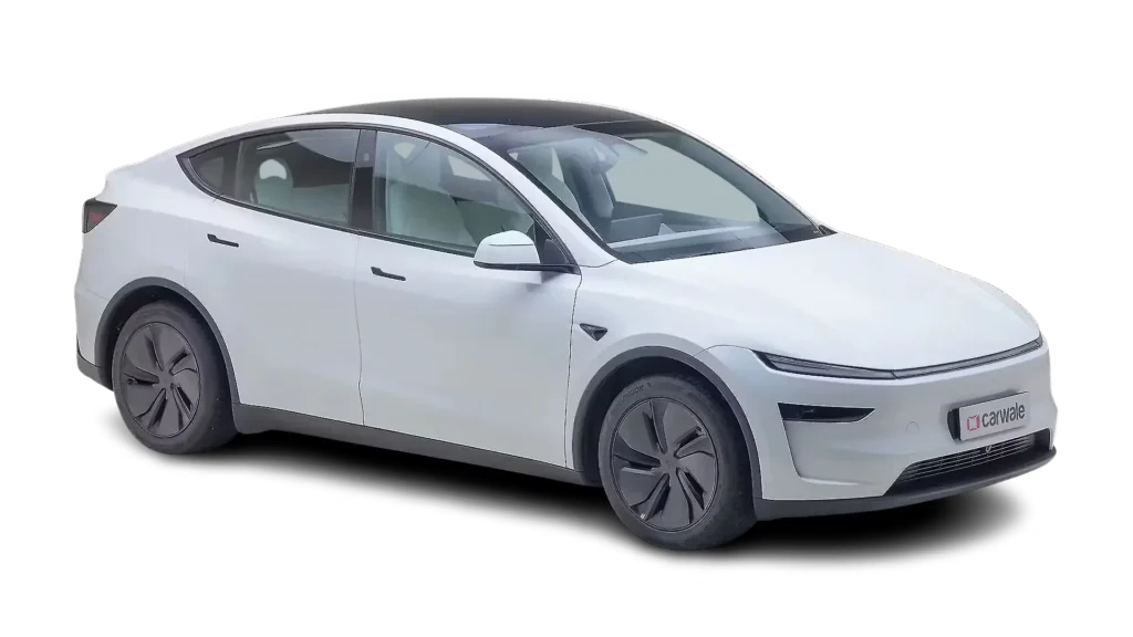 Tesla Model Y 2026 electric SUV parked on a road showcasing its modern design, long range, advanced technology and premium features.