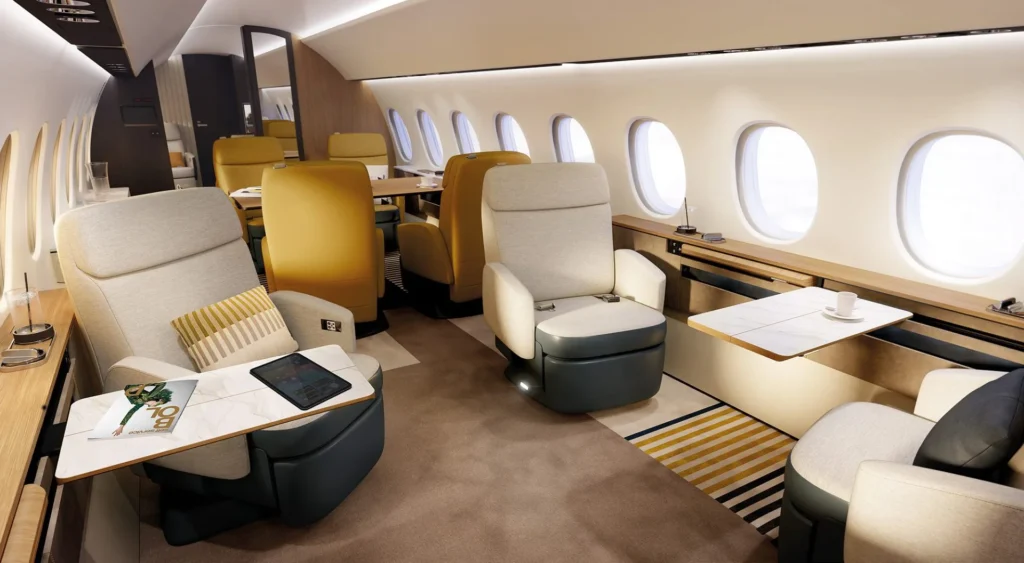 Dassault Falcon 10X private jet flying over the ocean