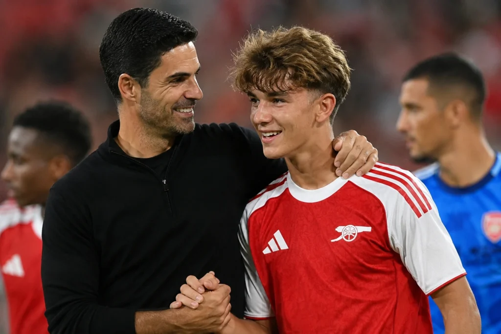 Mikel Arteta congratulates young Arsenal midfielder Max Dowman after Arsenal's 4-1 pre-season victory over Girona.