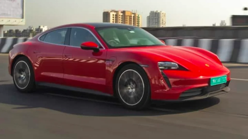 Luxury EV Boom in India with premium electric cars parked outside a modern city skyline.