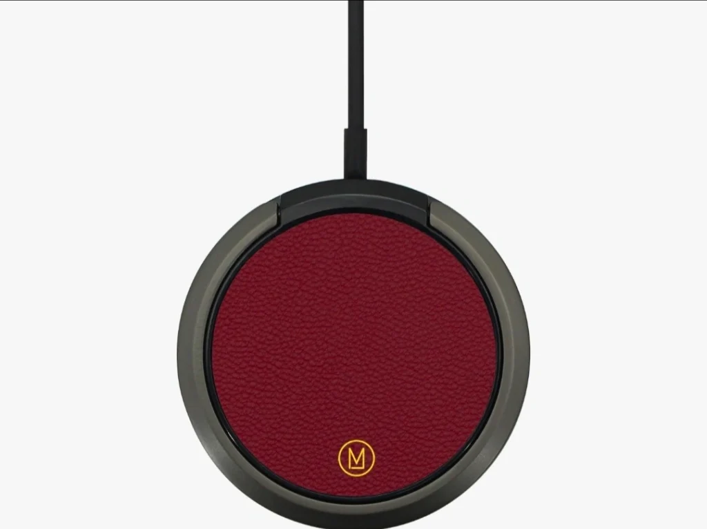 Burgundy iPhone 18 Pro with matching MagSafe charger, braided USB-C cable and premium accessories.