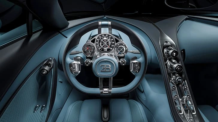 Bugatti Tourbillon V16 hybrid ke cockpit se start-up sequence ka premium driver experience aur Swiss-inspired interior ka close-up view.